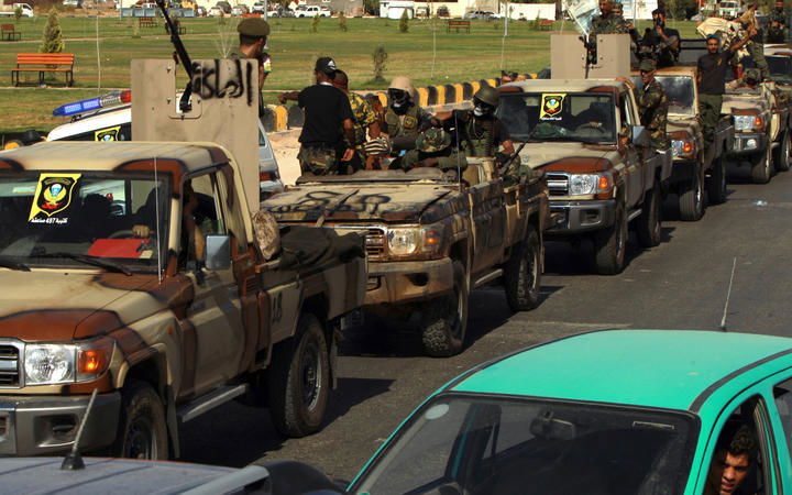 Members of the self-proclaimed eastern Libyan National Army (LNA) special forces gather in the city of Benghazi on June 18, 2020.