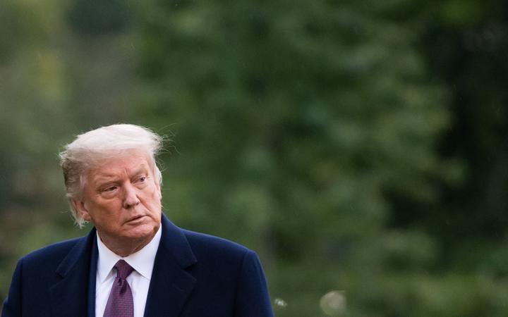 US President Donald Trump walks from Marine One after arriving on the South Lawn of the White House in Washington, DC, October 1, 2020, 