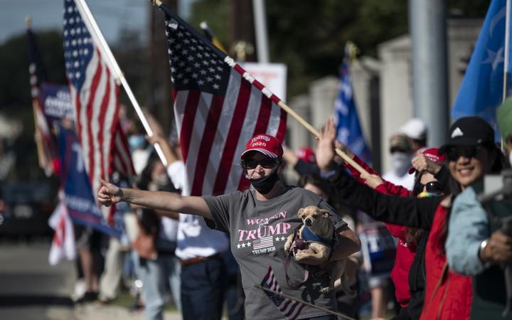 Supporters of US President Donald Trump gather outside of Walter Reed National Military Medical Center to show their support, on October 3, 2020, in Bethesda, Maryland. 