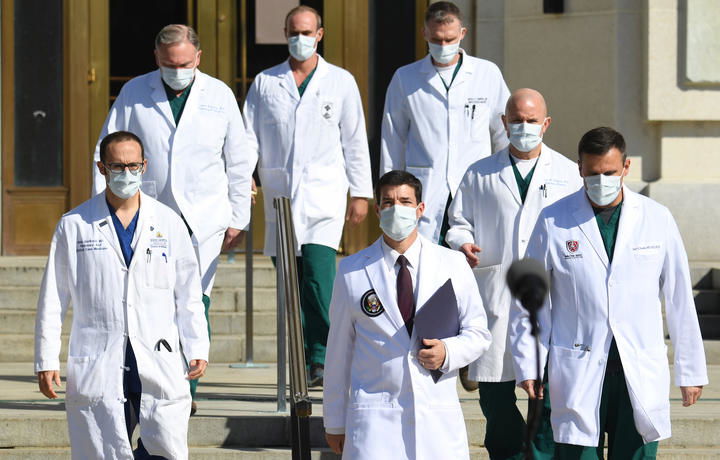 White House physician Sean Conley, centre, arrives to answer questions surrounded by other doctors, during an update on the condition of US President Donald Trump, on 5 October 2020, at Walter Reed Medical Center in Bethesda, Maryland. 