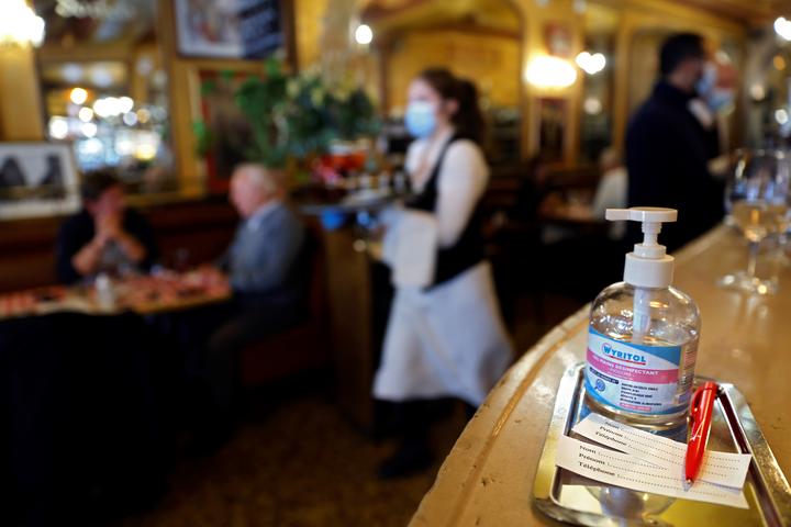 Hand sanitiser on the bar of a restaurant in Paris, where a four-week overnight curfew has been announced to fight the rapid spread of Covid-19. 14 October 2020.