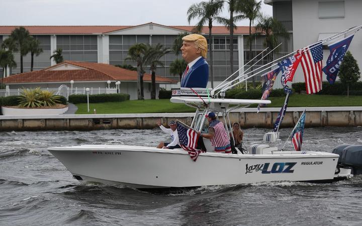 FORT LAUDERDALE, FLORIDA - OCTOBER 03: Boaters show their support for President Donald Trump during a parade down the Intracoastal Waterway on October 3, 2020 in Fort Lauderdale, Florida. 