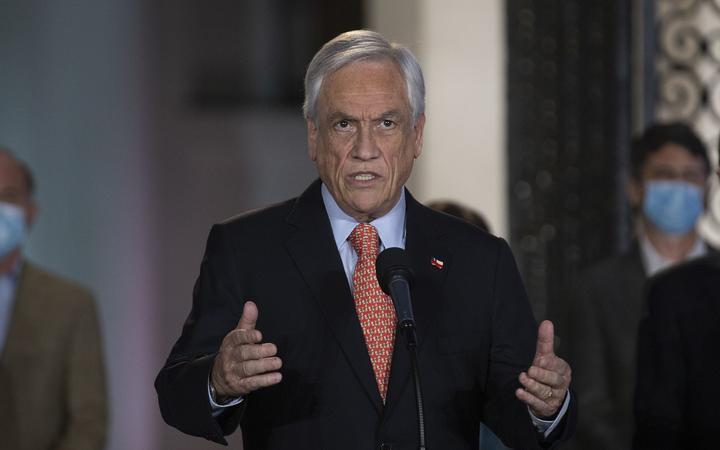 Chile's President Sebastian Pinera speaks at La Moneda presidential palace, in Santiago on October 25, 2020 following the results of the constitutional referendum voting. 