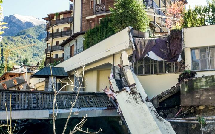 This photo taken on October 3, 2020 and provided by Italian news agency ANSA shows a block of concrete that collapsed from a building in a watercourse following bad weather and floods in Limone Piemonte, near Cuneo, Piedmont. 