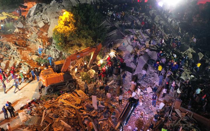 IZMIR, TURKEY - OCTOBER 30: A drone photo shows that search and rescue works continue at debris of a building in Bornova district after a magnitude 6.6 quake shook Turkey's Aegean Sea coast, in Izmir, Turkey on October 30, 2020. 