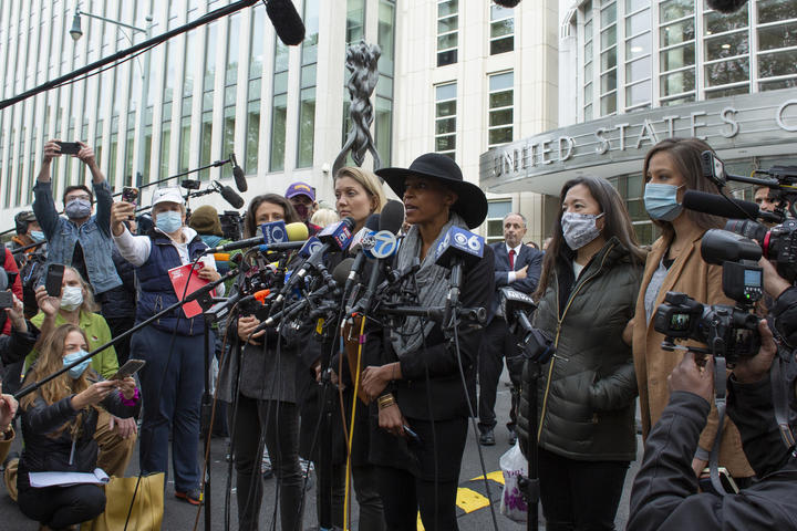 Former members of Nxivm, Linda Chung (2R), Nicki Clyne (L) and Michelle Hatchette (C) speak outside the court after Keith Raniere was sentenced to 120 years in prison.