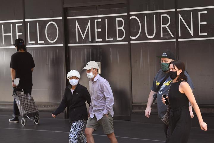 People return to Melbourne's central business district on 9 November 2020 as Australia's Victoria state government announces an easing of restrictions with no new cases of Covid-19 recorded for the tenth day in a row. 