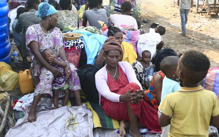 Ethiopian refugees who fled intense fighting in their homeland of Tigray, gather at the border reception centre of Hamdiyet, in the eastern Sudanese state of Kasala, on November 14, 2020. 