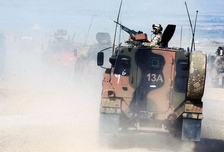 Australian soldiers of the NATO-led International Security Assistance Force (ISAF) patrol in Tirin Kot, the capital of Uruzgan province in Afghanistan on 17 February 2007. 