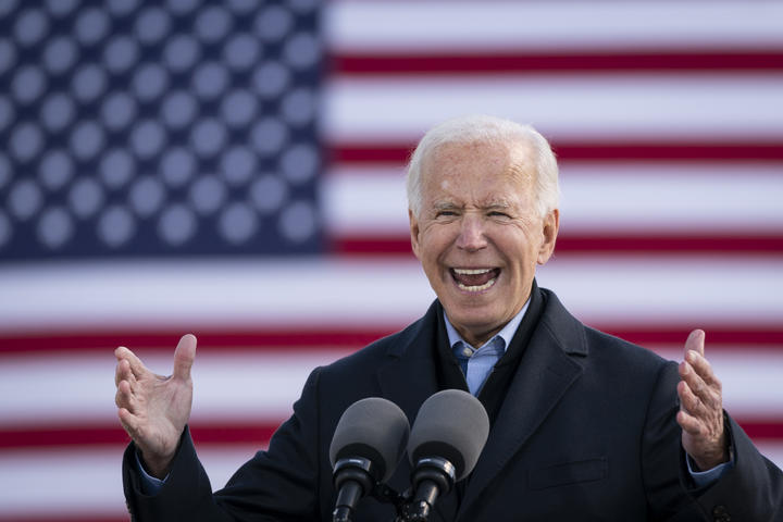 Democratic presidential nominee Joe Biden speaks during a drive-in campaign rally in Iowa. 30 October (file).