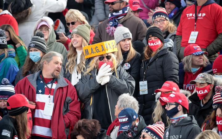 Supporters of President Donald Trump attend a campaign rally in Green Bay, Wisconsin, four days before the 3 November election. 30 October 2020