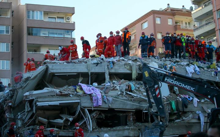 IZMIR, TURKEY - OCTOBER 31: Search and rescue works continue at debris of a building following a magnitude 6.6 quake shook Turkey's Aegean Sea coast, in Izmir, Turkey on October 31, 2020. 