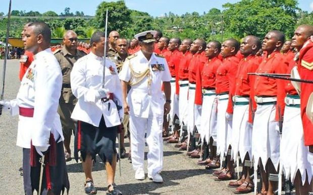 Fiji PM Frank Bainmarama inspects a military pass out parade.