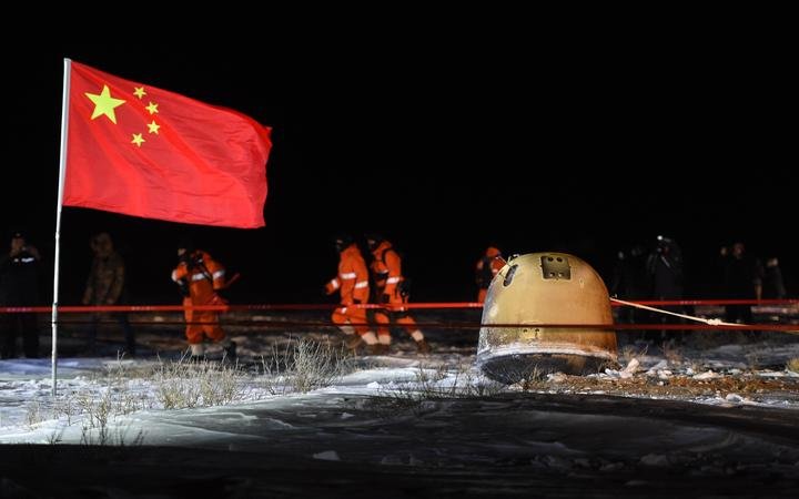 The return capsule of China's Chang'e-5 probe lands in Siziwang Banner, north China's Inner Mongolia Autonomous Region, on Dec. 17, 2020.