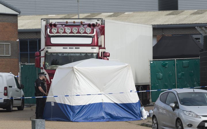 Police officers work at the scene where 39 bodies were found in a shipping container at Waterglade Industrial Park in Essex, Britain, on Oct. 23, 2019.