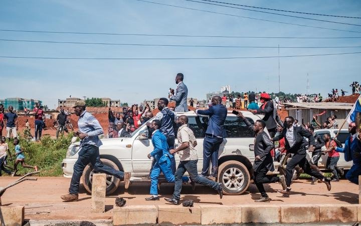 Musician turned politician Robert Kyagulanyi (C top), also known as Bobi Wine, greets supporters as he makes his way to be officially nominated as presidential candidate, in Kampala, Uganda.