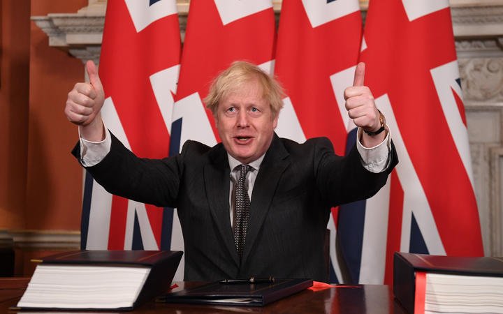 Boris Johnson gives a double thumbs up after signing the Trade and Cooperation Agreement between the UK and the EU, the Brexit trade deal, at 10 Downing Street in central London on 30 December 2020. 