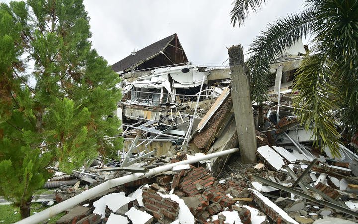 A general view shows a collapsed building in Mamuju 