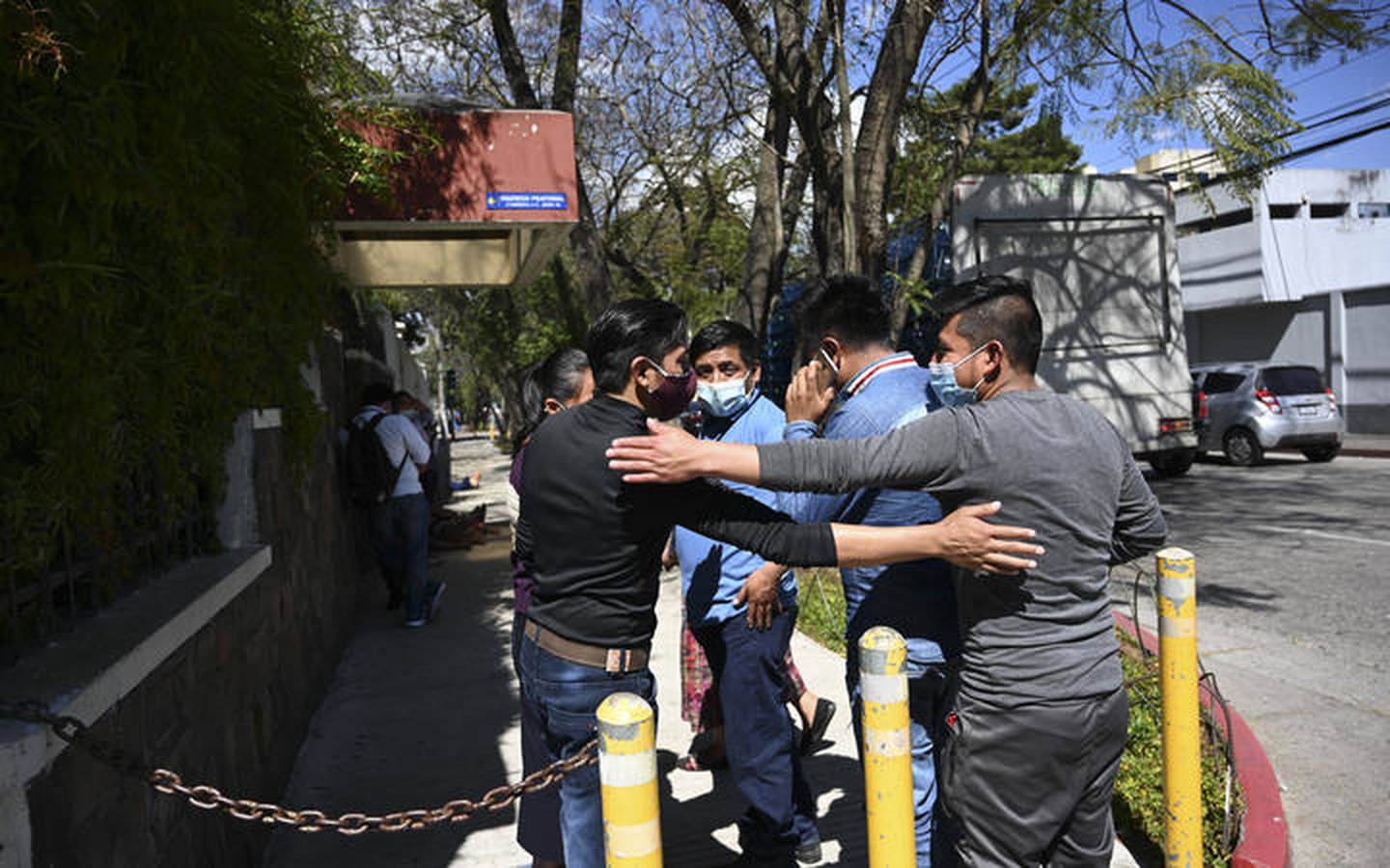People remain outside the Ministry of Foreign Affairs in Guatemala City on January 25, 2021, after giving details of their relatives who might be in the group among people found burned to death on a rural road in the state of Tamaulipas, Mexico.
