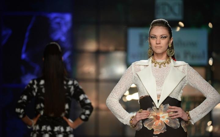 A model presents a creation by Indian designer Satya Paul during the PCJ Delhi Couture Week 2013 in New Delhi on August 2, 2013. 