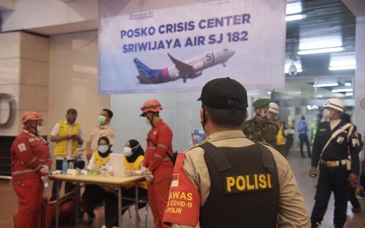 TANGGERANG, INDONESIA - JANUARY 9: A police officer stands guard at the crisis center for victims of the Srwijaya Air plane crash with flight number SJ 182 at Soekarno Hatta Airport, Tangerang, Banten Province, Indonesia on January 9, 2021. 