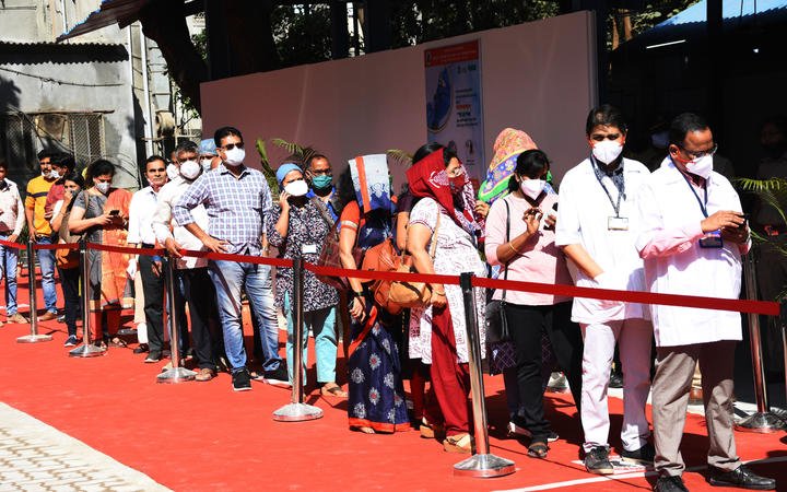 Indian Health workers wait in line to receive a Covid-19 coronavirus vaccine in Mumbai, India.