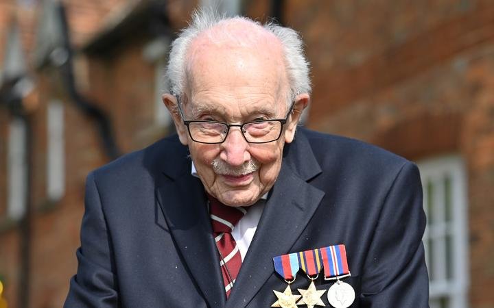 In this file photo taken in April 2020, British World War II veteran Captain Sir Tom Moore is pictured during a lap of his garden in the village of Marston Moretaine, 50 miles north of London.
